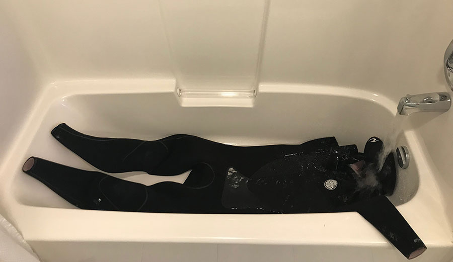 Wetsuit in bathtub