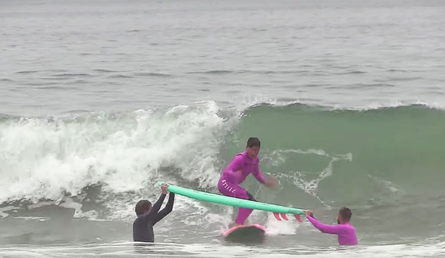 Kalani Robb hippie jump on surfboard