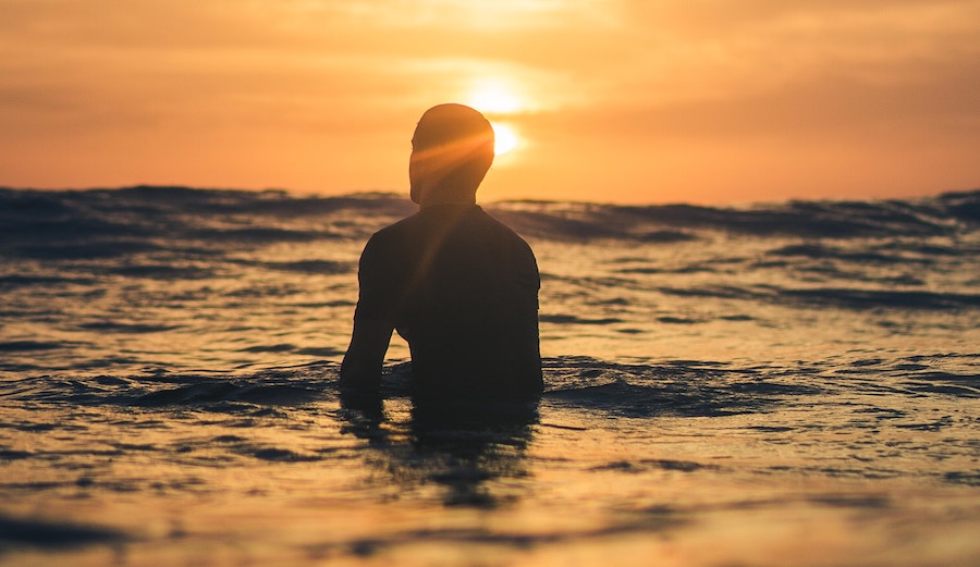 Man waiting for wave. Dawn patrol.