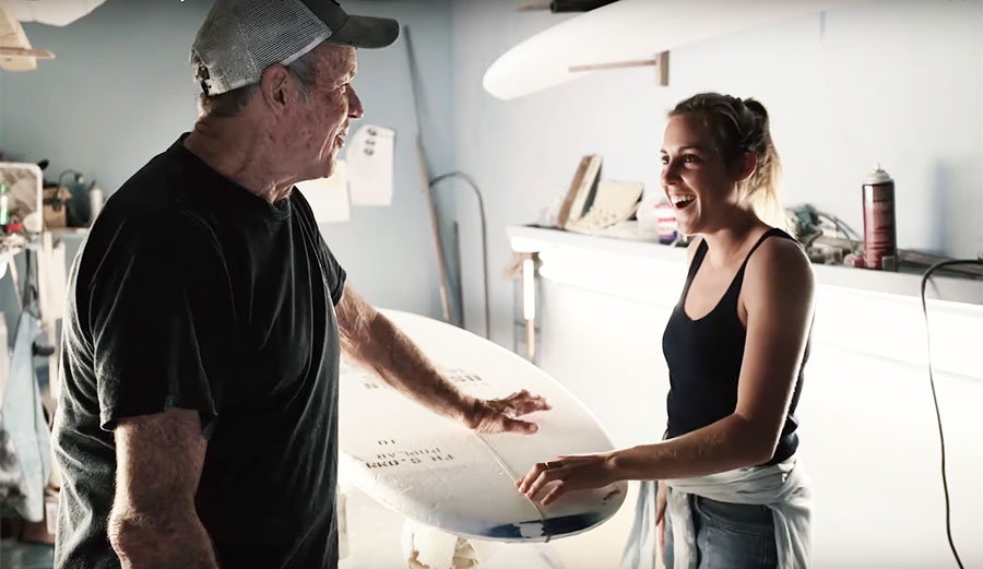 Leila Hurst and Bill Hamilton shaping a surfboard