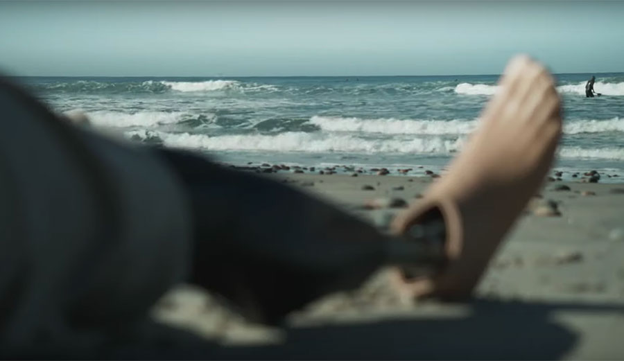 Dani Burt surfing