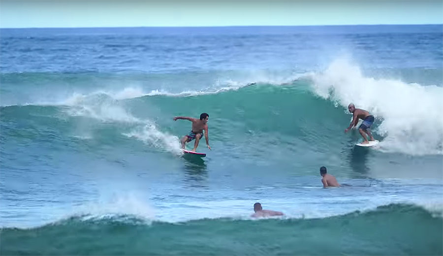 Mason Ho and Michael Ho surfing