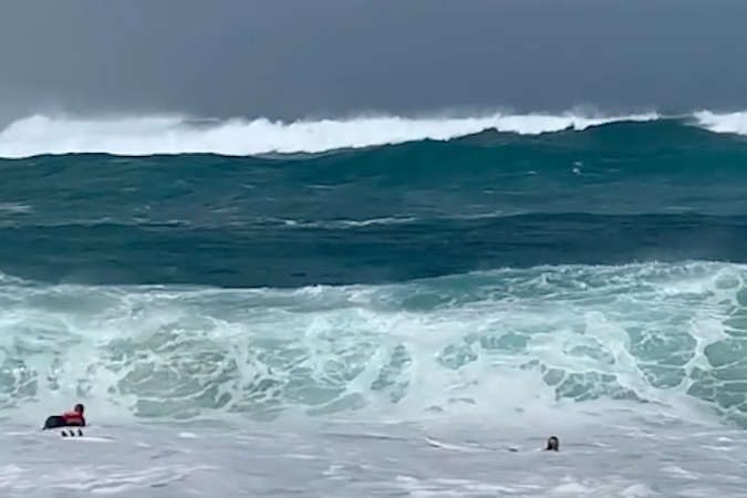 Kelly Slater and His Board Caddy, Jackson Dorian, Got Worked in the Sunset Beach Shorebreak