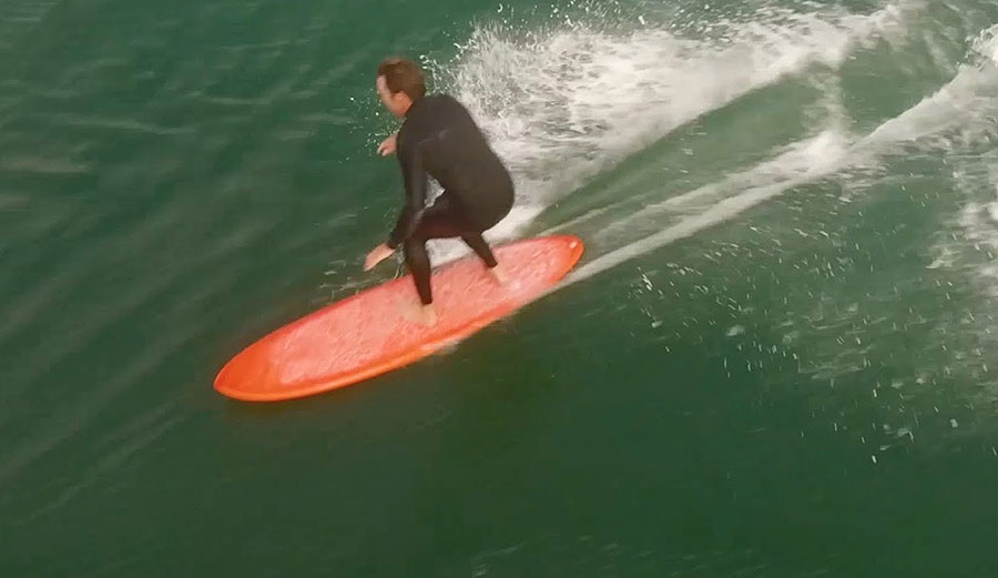 Devon howard surfing on a mid-length surfboard