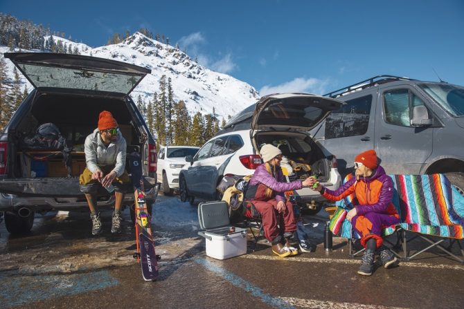 McKenna Peterson, Sam Cohen, Amie Engerbretson enjoying some apre ski beers in the parking lot of Alpine Meadows. Photo: IKON Pass.