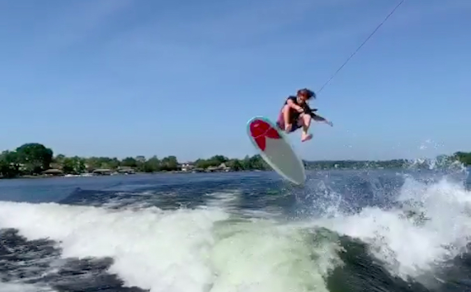 Watch This Guy Throw a Picture-Perfect Kickflip on a Single Fin Behind a Boat