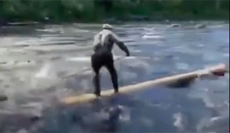 Old man riding a log