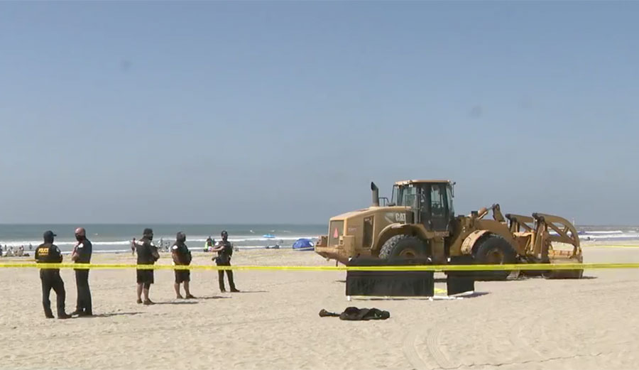 Wheel loader tractor on Oceanside beach