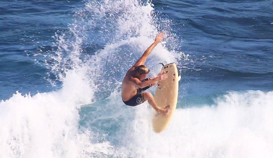 Clay Marzo surfing in blue water on Maui on a Catch Surf surfboard