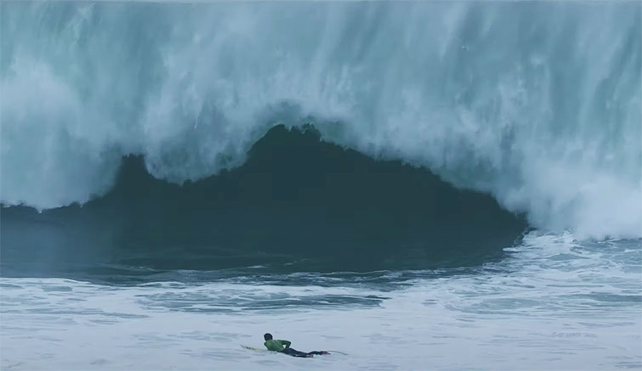 Surfer duck diving big wave in Europe