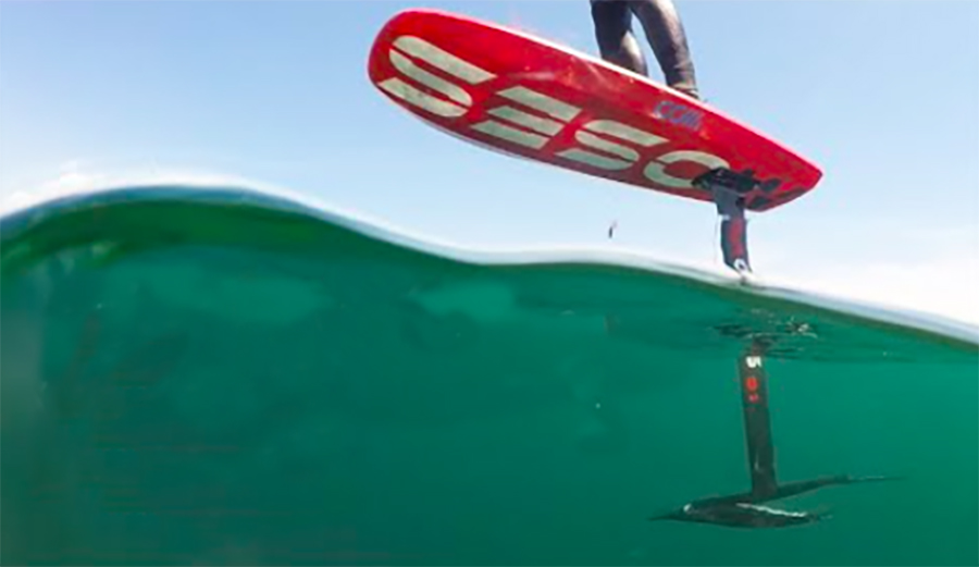 a foil surfer in the water