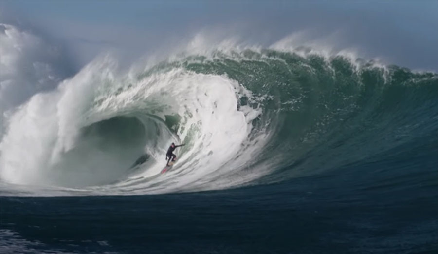 Conor Maguire surfing a barreling wave in Ireland