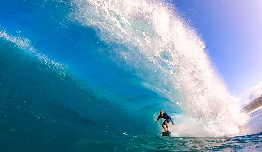 Jamie O'Brien surfing a barreling wave at Backdoor, North Shore, Oahu
