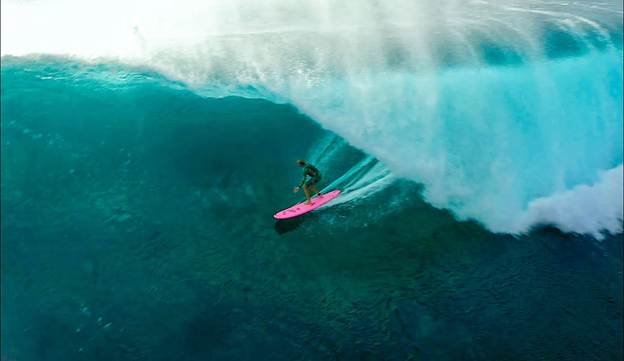 Jamie O'Brien catches a Pipeline barrel on a soft top surfboard