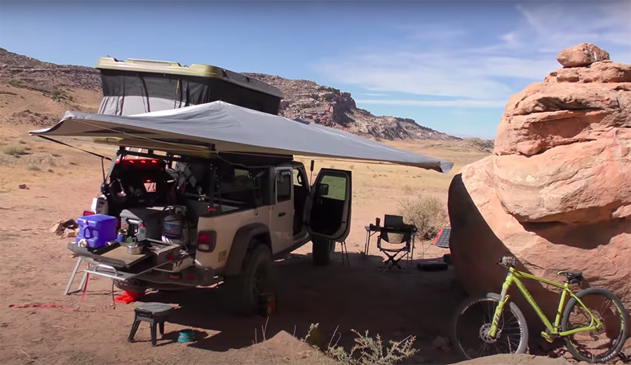 a rooftop tent and mobile office setup