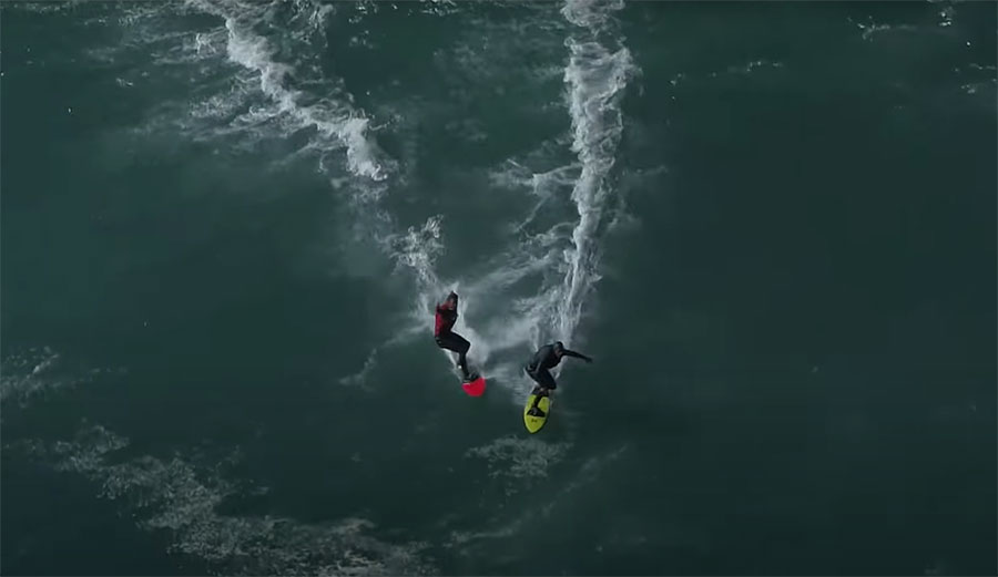 Nic Von Rupp and João Guedes surfing at Nazare