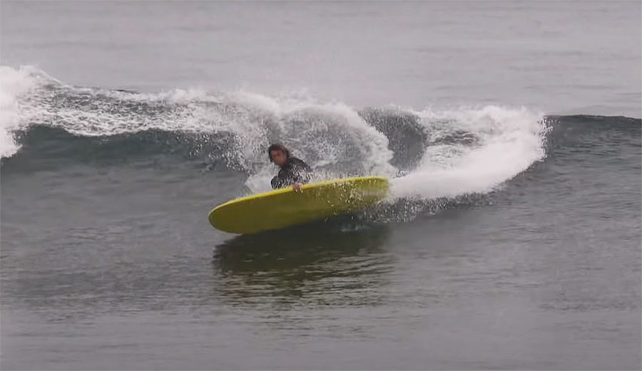 Ryan Burch surfing on a finless surfboard