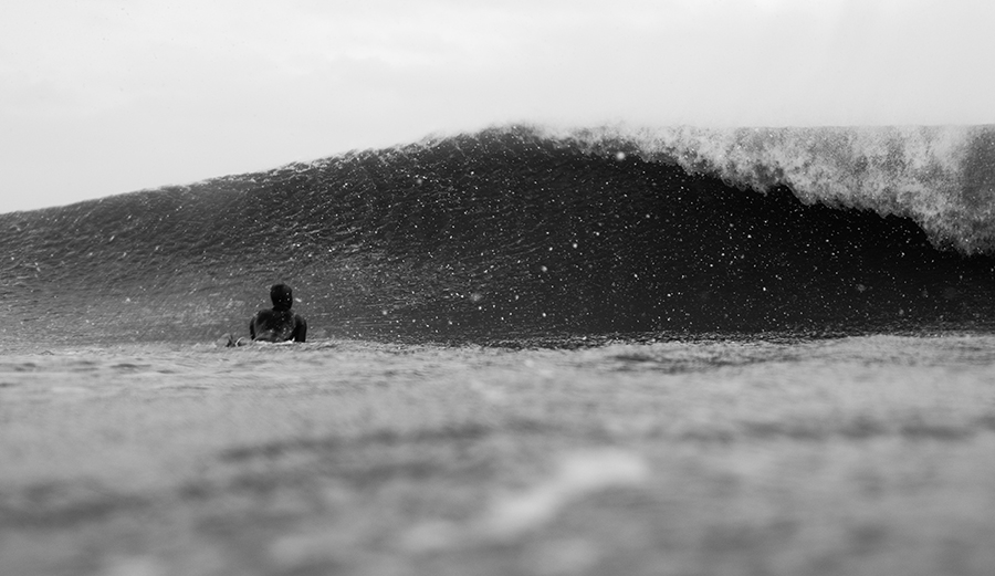 man about to duck-dive under a wave in Rhode Island