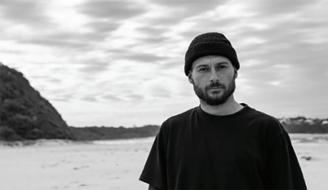 Dion Agius in front of the ocean