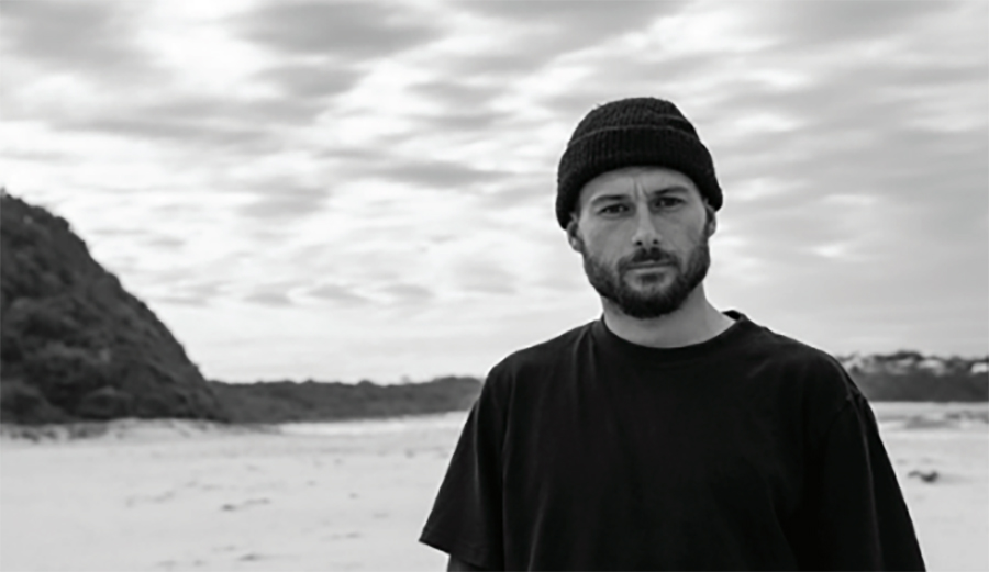 Dion Agius in front of the ocean