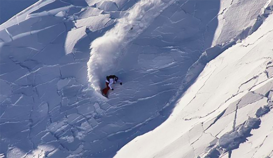 Mat Schaer escaping an avalanche on his snowboard in the Alps