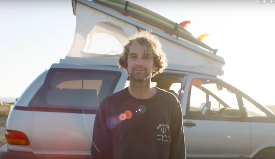 Jay Nelson stands in front of a pop top that he built