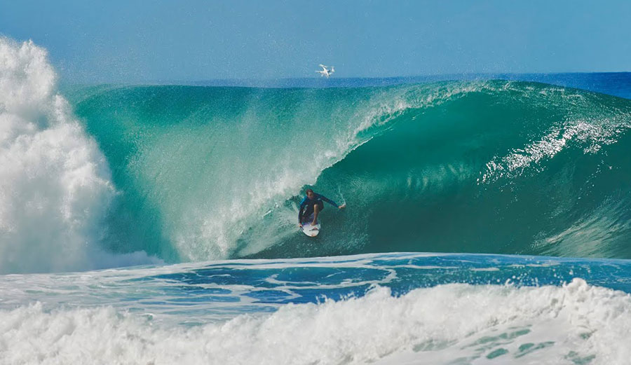 Jamie O'Brien surfing a wave at Pipeline