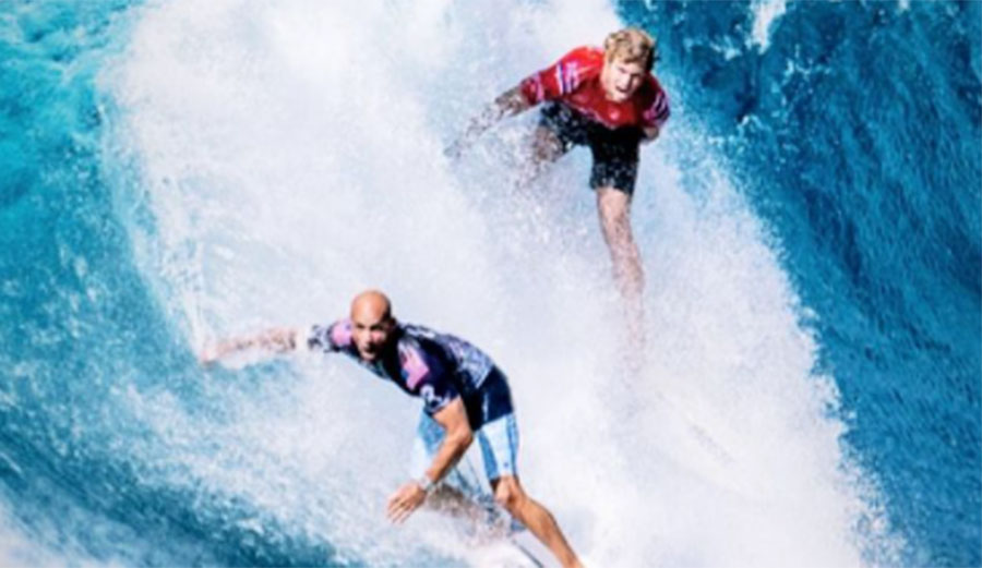 Kelly Slater and John John Florence surfing at Pipe Masters