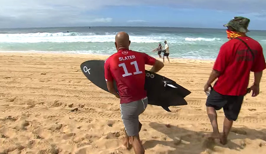 Kelly Slater running to beach at Pipeline