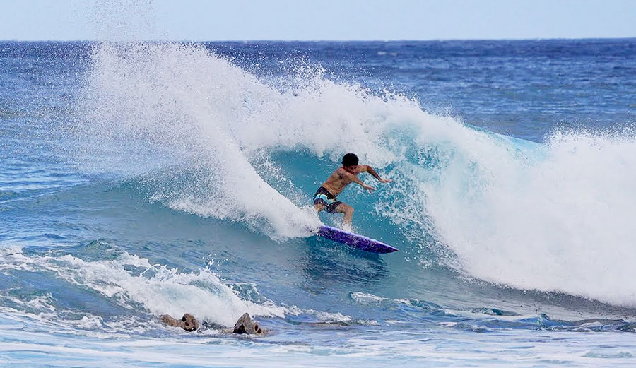 Mason Ho surfing on Oahu
