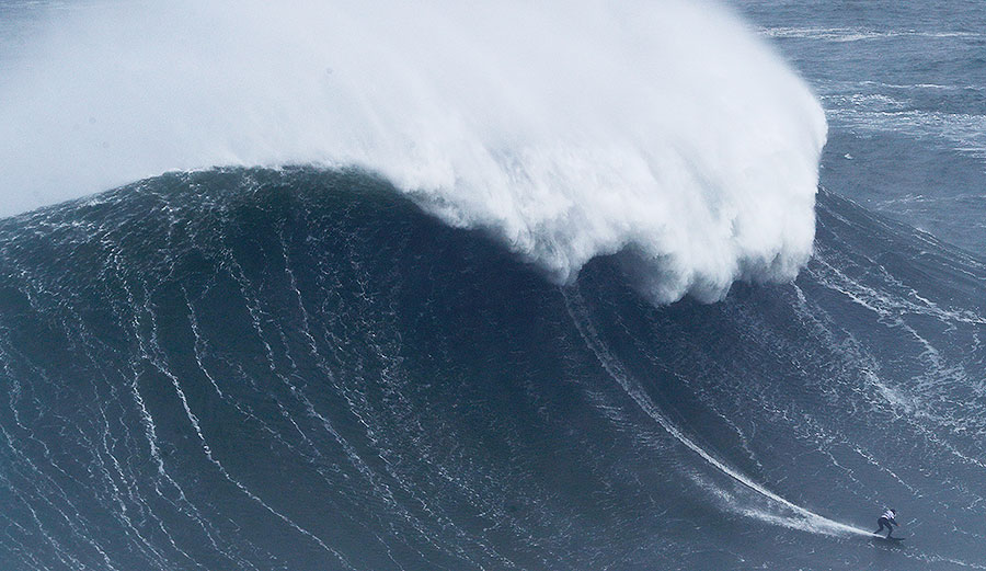 Surfer at Nazare in Portugal