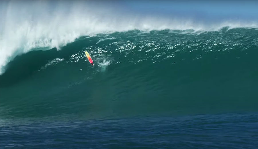 Koa Smith's surfboard going over a huge wave at Phantoms