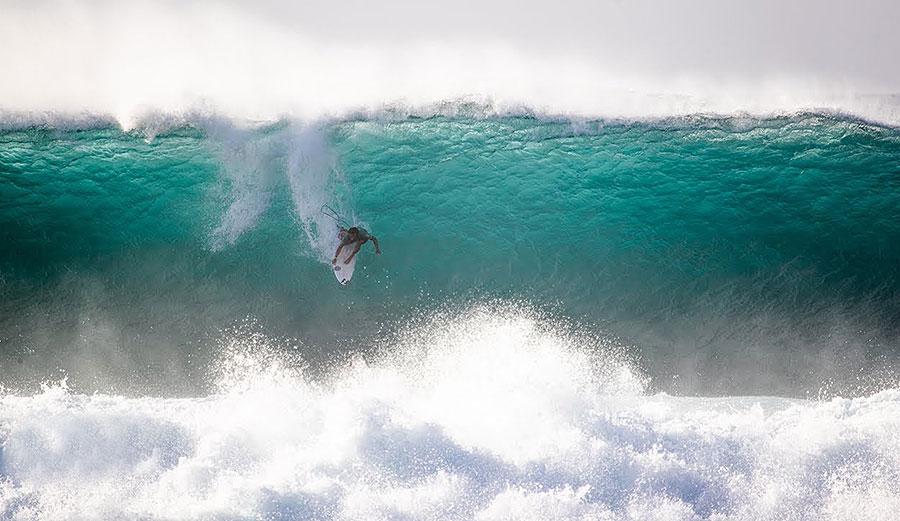 Surfing dropping in at Pipeline, North Shore Oahu