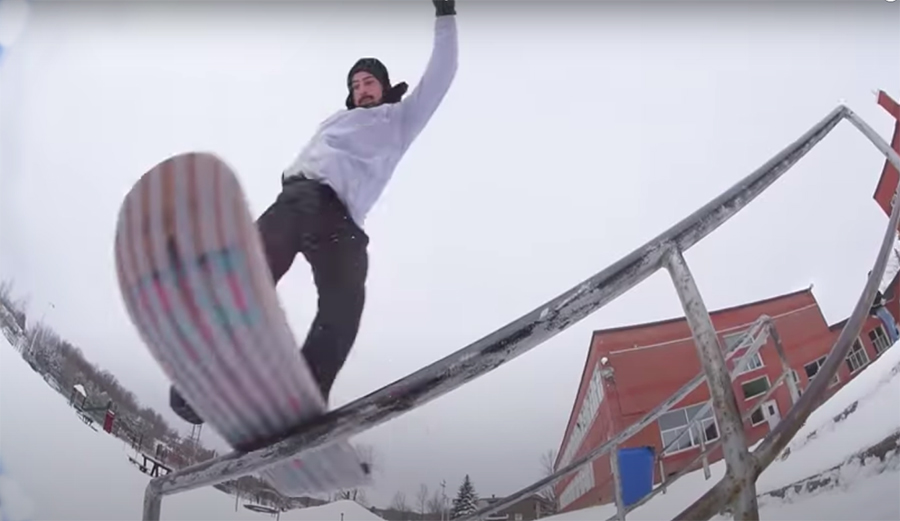 Dave Engerer on a snowskate riding a rail