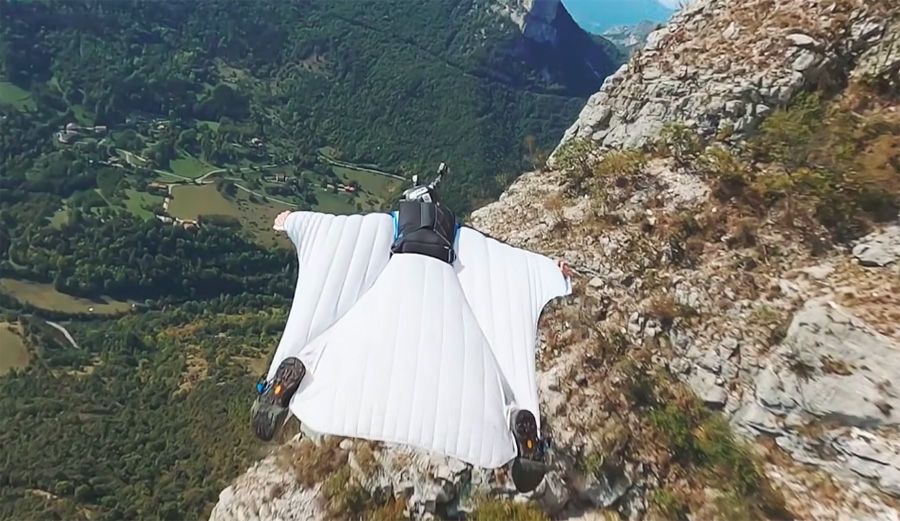 Footage of wingsuit BASE jumper captured by drone