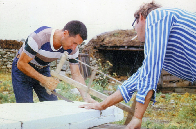 Nikolai Petrovich Popov and Vladimir Prozorovsky working on their first surfboard and