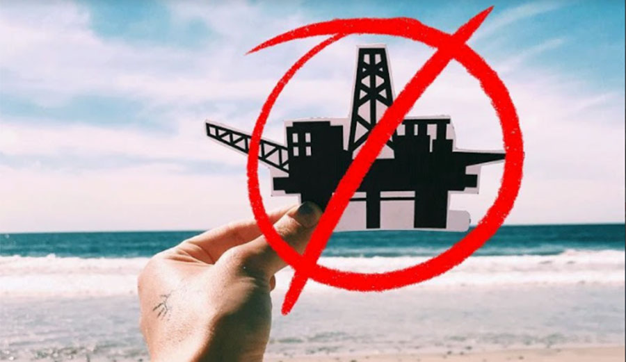 Oil derrick on Pacific coastline