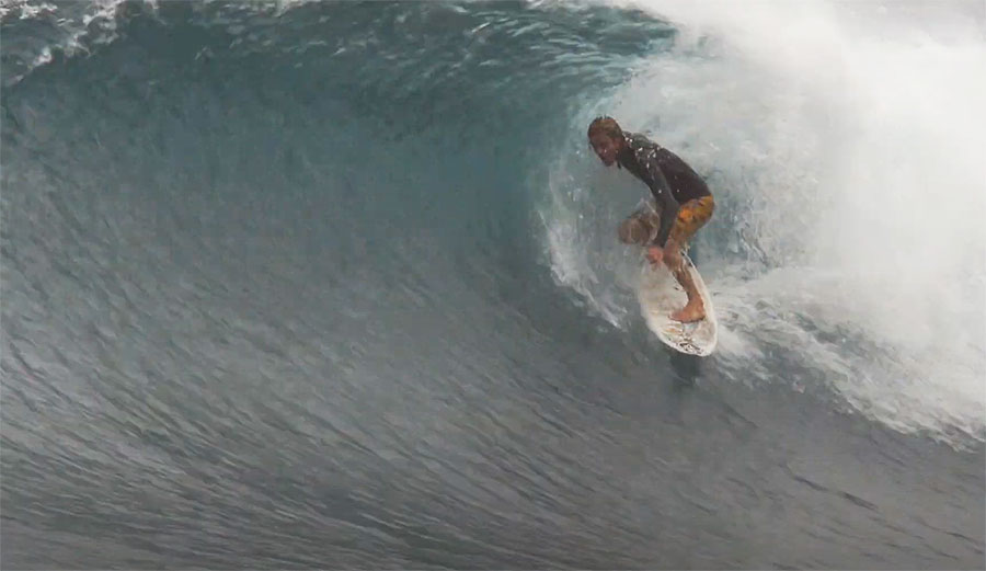 Gavin Beschen surfing in the barrel on Oahu North Shore