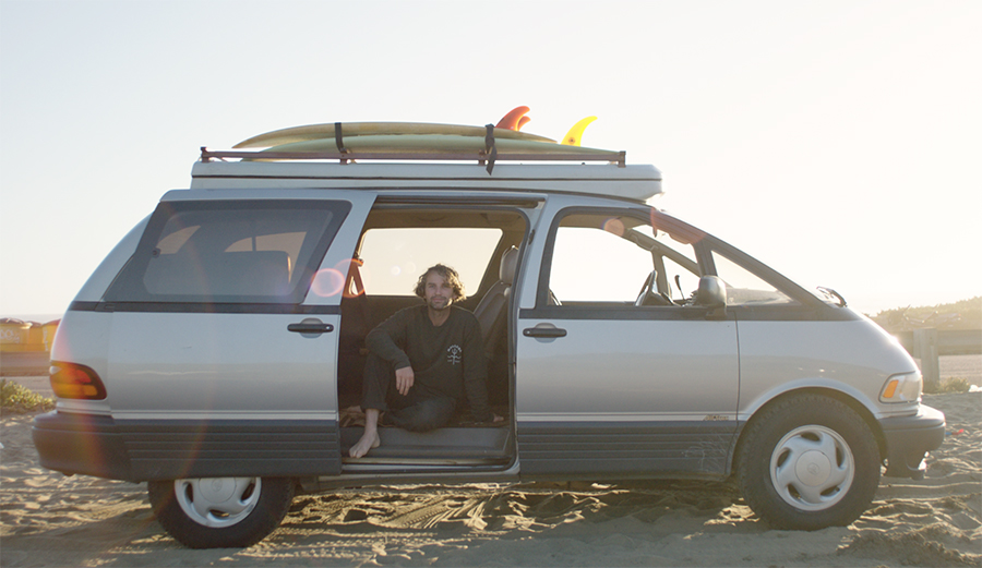 Jay Nelson in his DIY 1994 Toyota Previa Pop Top Campervan