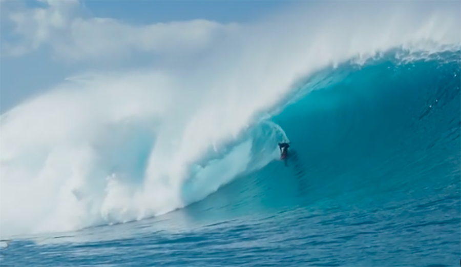 John John Florence in the barrel of a big outer-reef wave on Oahu