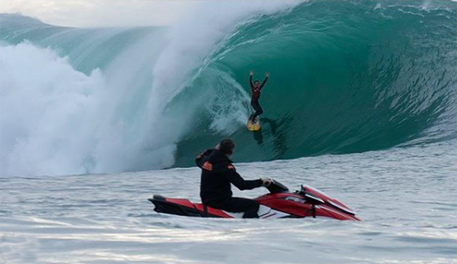 Surfer John Mel catches a left at Maverick's