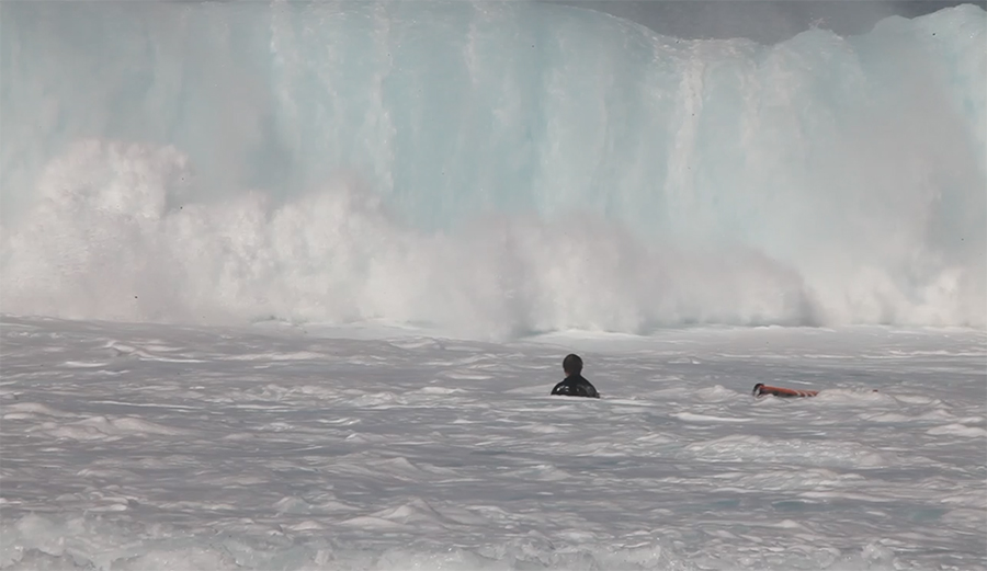 Mark Healey ditches his board in front of a big wave