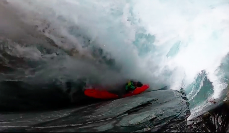 A whitewater kayaker gets caught in a sieve on a river in New Zealand