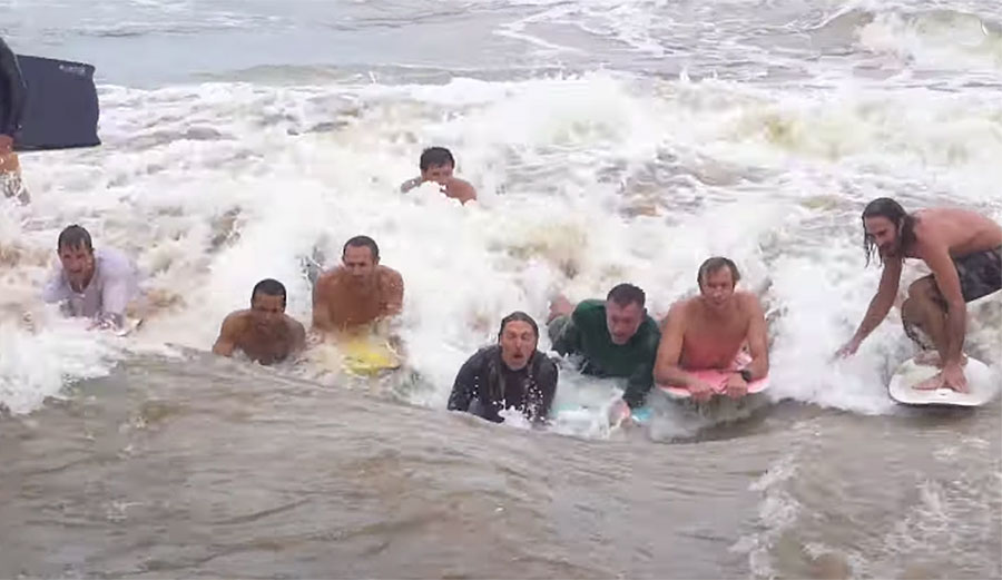 Jamie O'Brien and others surfing the Waimea River wave