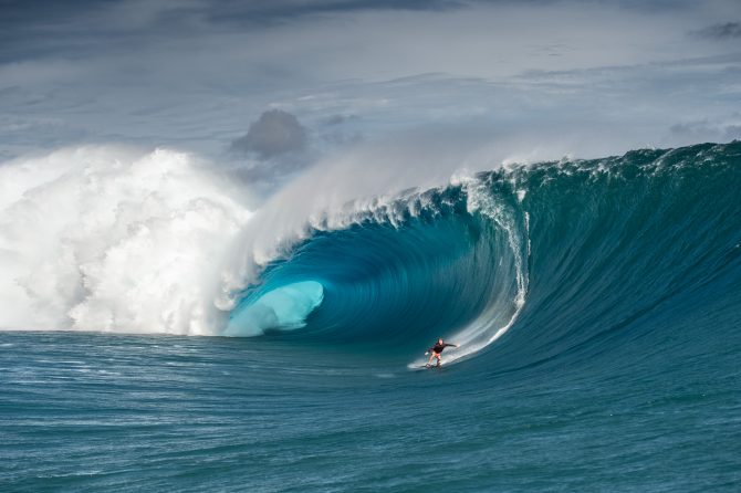 Mark Healey riding down the face of a wave.