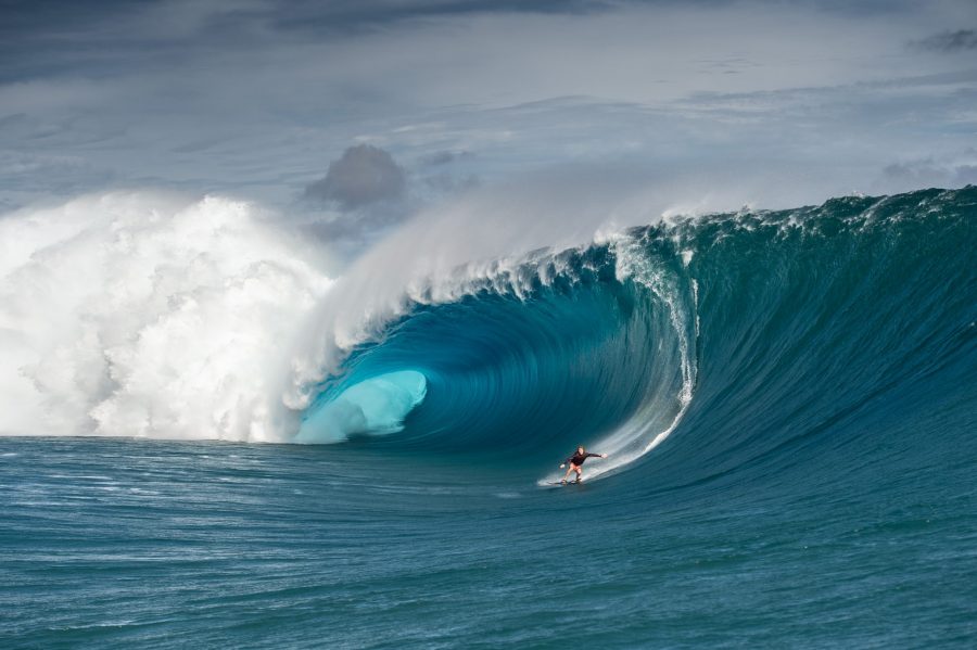 Mark Healey riding down the face of a wave.