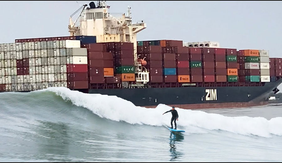 Ben Gravy surfing wave from tanker ship