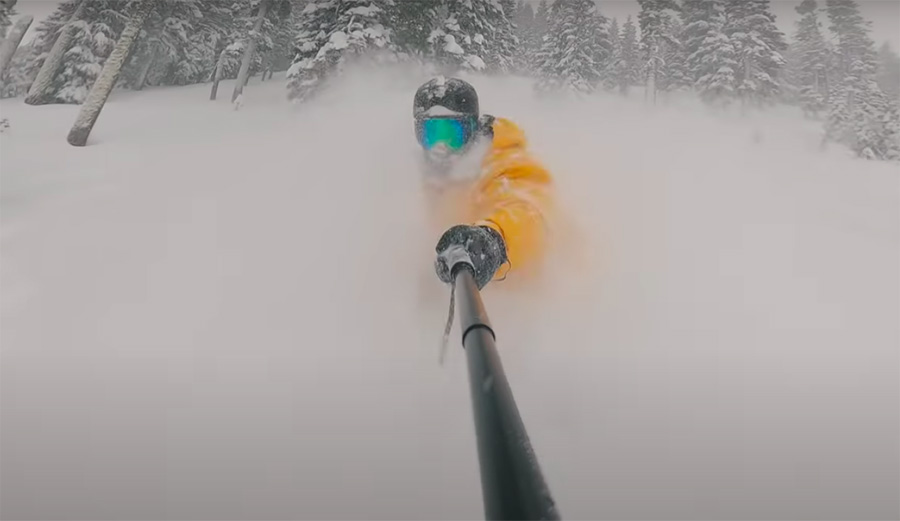 Casey Willax snowboarding in deep powder