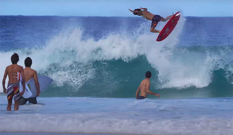 Mason Ho surfing at Ehukai Beach Park