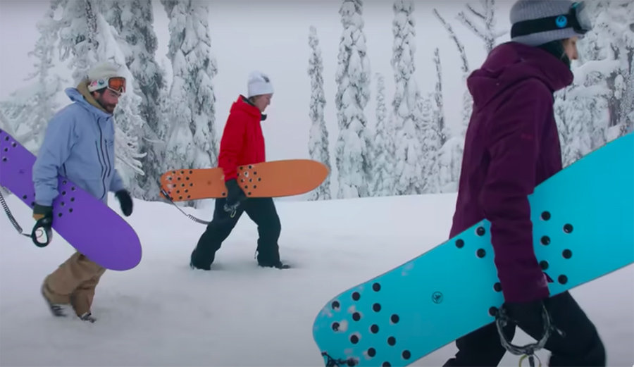 Danny Davis and Red Gerard walk with pow surfers